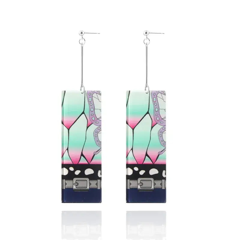 Rectangular acrylic butterfly drop earrings with mint green to pink gradient and black belt details demon slayer tanjiro