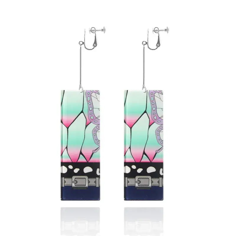Demon slayer tanjiro acrylic butterfly drop earrings with teal pink gradient butterfly wing design and black belt detail