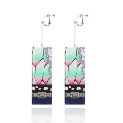 Demon slayer tanjiro acrylic butterfly drop earrings with teal pink gradient butterfly wing design and black belt detail