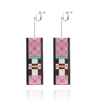 Rectangular pink and black acrylic demon slayer tanjiro butterfly drop earrings with teal and beige geometric accents