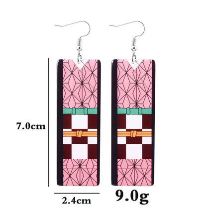 Pair of rectangular acrylic butterfly drop earrings with pink maroon geometric design and silver hooks inspired by demon slayer tanjiro