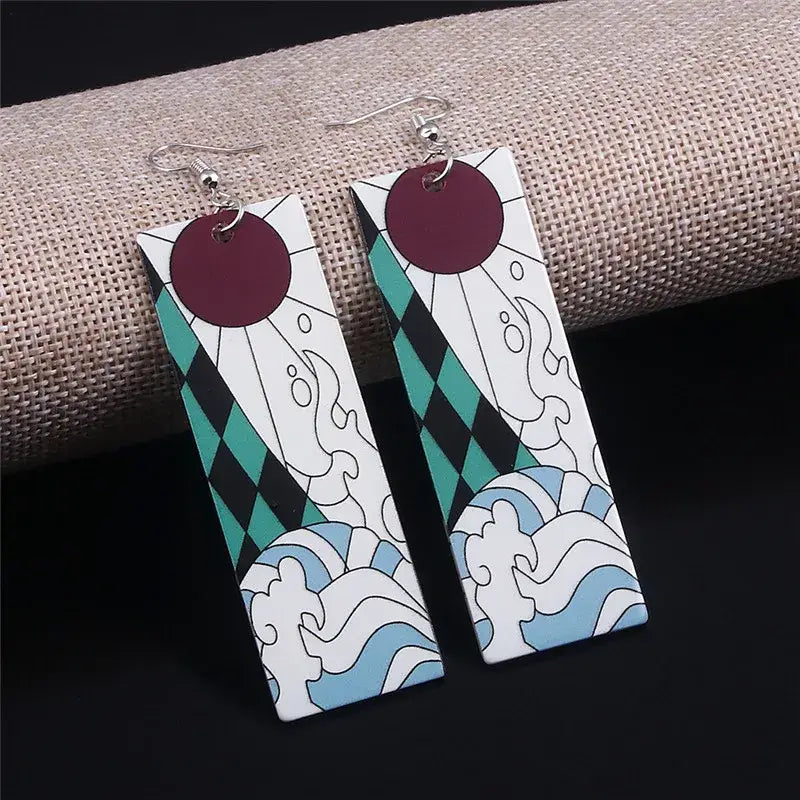Rectangular white acrylic demon slayer tanjiro butterfly drop earrings with maroon circle teal diamond and blue wave motifs