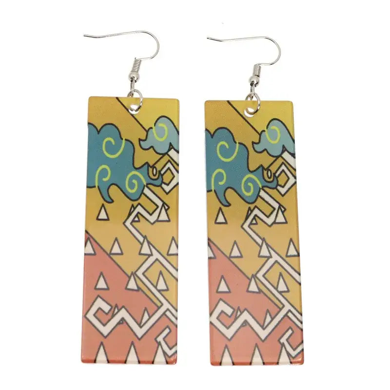 Rectangular demon slayer hanafuda earrings with vibrant teal and yellow acrylic drop design on orange gradient background