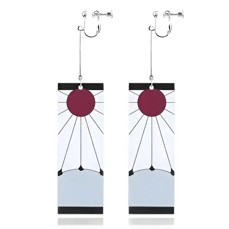 A pair of demon slayer hanafuda acrylic drop earrings with rectangular sunburst design and deep red circle top