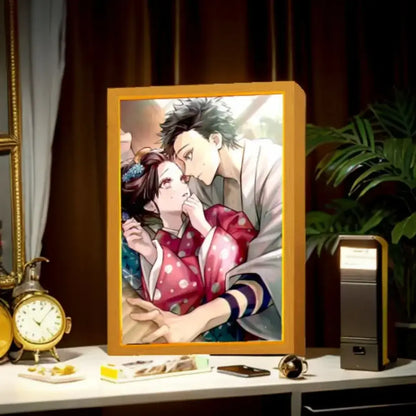 Golden-framed demon slayer tanjiro anime decor led light frame featuring a romantic scene with traditional attire characters