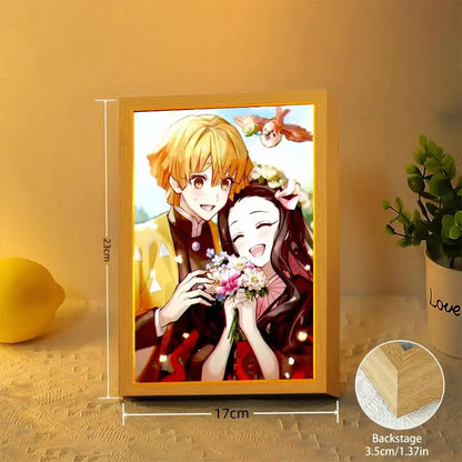 Lighted wooden Demon Slayer Tanjiro LED light frame with warm glow featuring anime illustration of two characters holding flowers