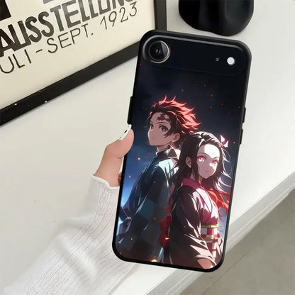 Black soft demon slayer tanjiro phone case featuring anime characters with red and white accents on the back side
