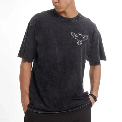 Black distressed cotton t-shirt with white embroidered bird design featuring zenitsu agatsuma retro washed street style