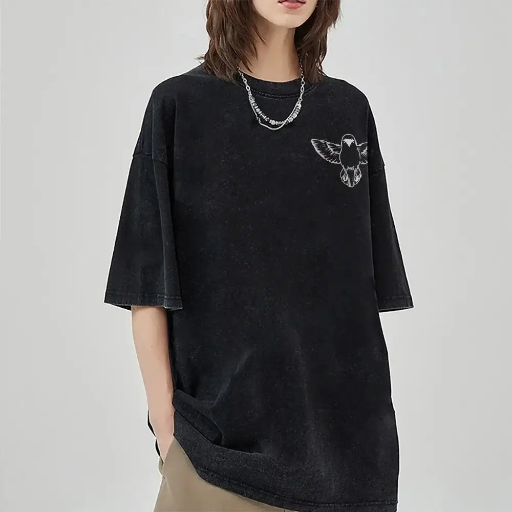 Black oversized retro washed t-shirt with faded texture and white embroidered bird for zenitsu agatsuma street style