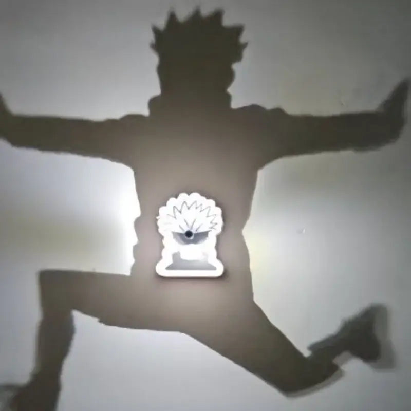 A glowing white led detective conan goku projector lamp shaped like a spiky-haired anime head as a night light