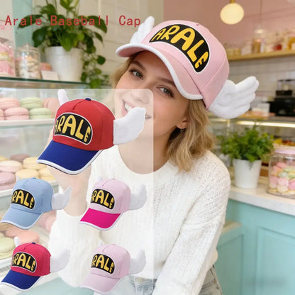 Pink dr slump arale baseball cap with plush wing details and black lettering on yellow background