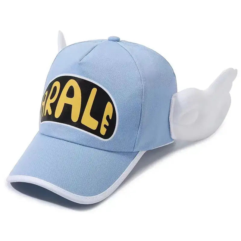 Light blue dr. slump arale baseball cap with plush wing details, white wings, devil horns, and yellow rrale logo patch
