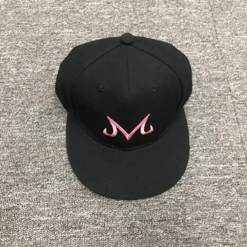 Black cotton dragon ball buu snapback cap featuring a pink embroidered m logo for hip hop style