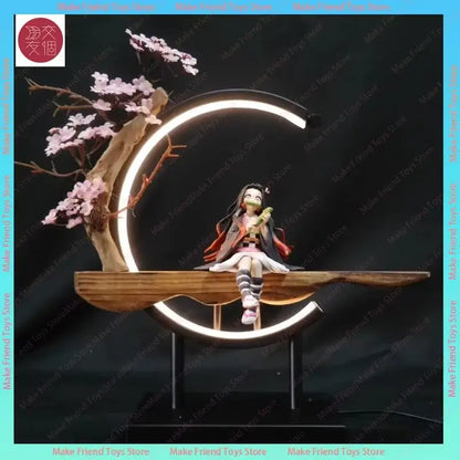 Detailed anime figurine of dragon ball gogeta with long dark hair seated under a crescent moon led lamp on wooden platform