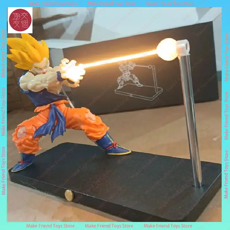 Golden-haired super saiyan Goku action figure in orange and blue gi posed with glowing energy blast in dragon ball gogeta lamp