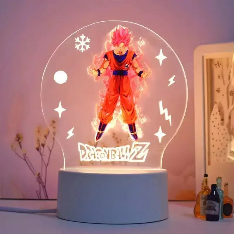 A glowing translucent acrylic led night light featuring vibrant pink-haired goku in super saiyan form with snowflakes