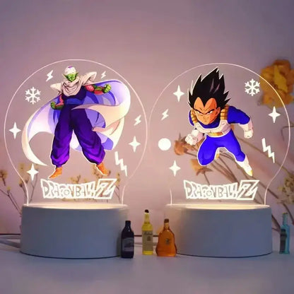 Two illuminated led night light desk lamps featuring dragon ball z piccolo in purple and vegeta in blue with glowing effects