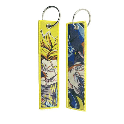 Dragon ball goku embroidery lanyard keychain holder with two yellow embroidered anime character keychains in blue armor and spiky hair