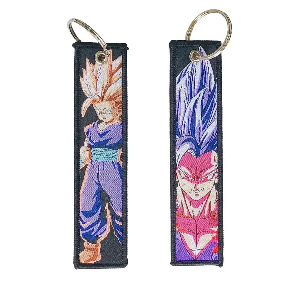 Two embroidered dragon ball keychain holders featuring dragon ball goku in purple and blue anime character designs