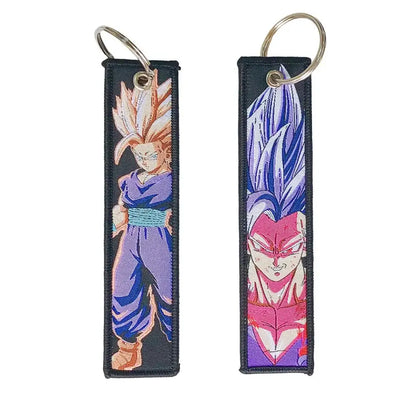Two embroidered dragon ball keychain holders featuring dragon ball goku in purple and blue anime character designs
