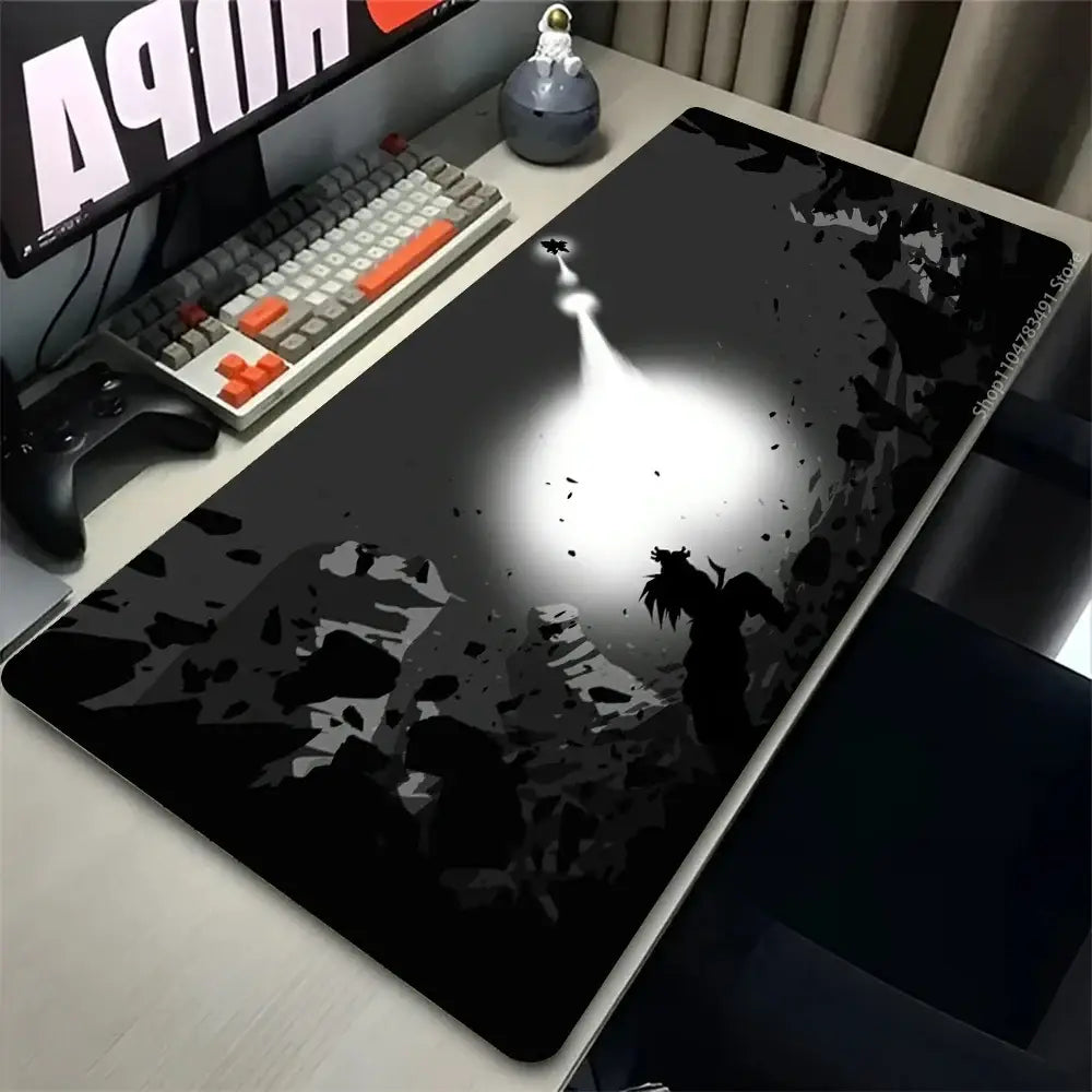 Black and gray rubber desk mat mouse pad featuring an astronaut silhouette illuminated by dramatic spotlight for gaming mouse use
