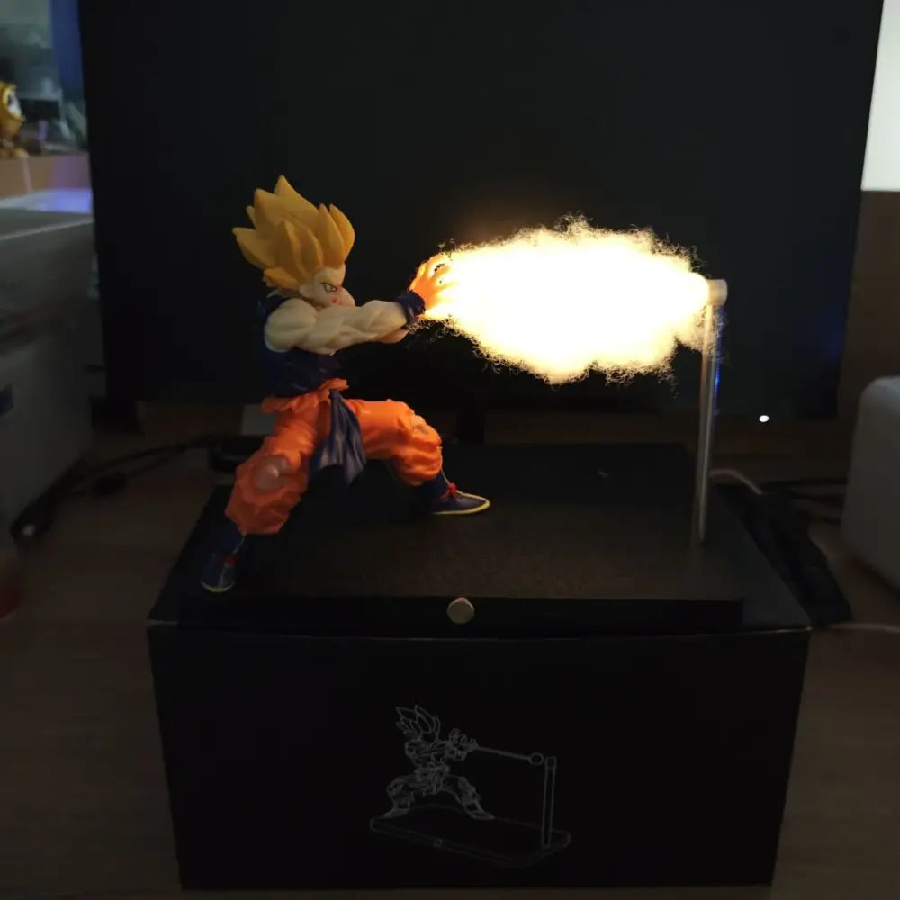 Dragon ball goku led desk lamp with magnetic base featuring a spiky golden hair figurine firing a glowing energy blast
