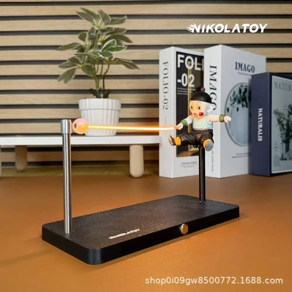 Nikolatoys dragon ball goku led desk lamp with magnetic base features an orange glowing beam connecting to a metallic sphere