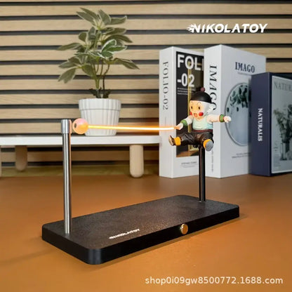 Nikolatoys dragon ball goku led desk lamp with magnetic base features an orange glowing beam connecting to a metallic sphere