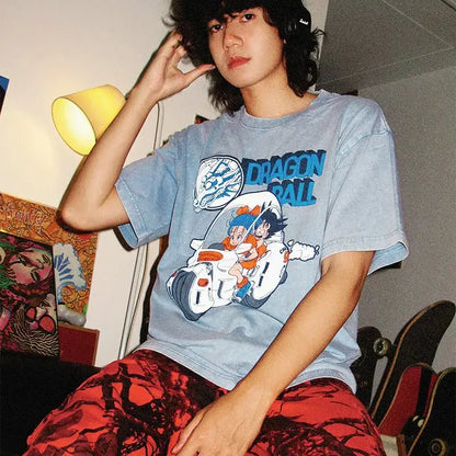 Light blue cotton dragon ball goku oversized t-shirt with vibrant motorcycle graphic of goku and bulma vintage washed