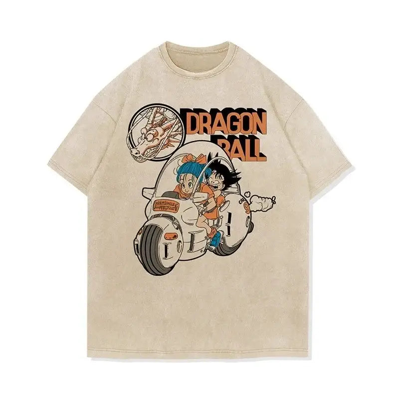 Beige dragon ball goku oversized t-shirt featuring vintage-style graphic of goku and bulma on motorcycle with orange lettering