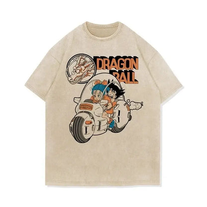 Beige dragon ball goku oversized t-shirt featuring vintage-style graphic of goku and bulma on motorcycle with orange lettering