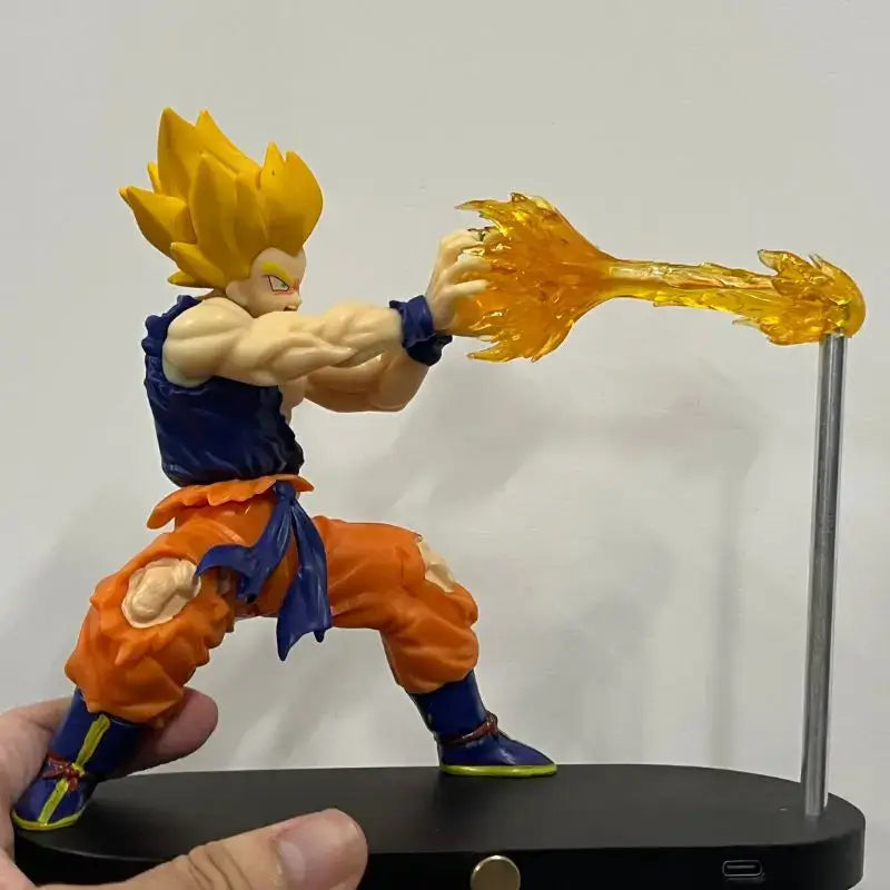Detailed plastic dragon ball goku super saiyan figurine with spiky golden hair holding energy blast in vegeta magnetic desktop night light