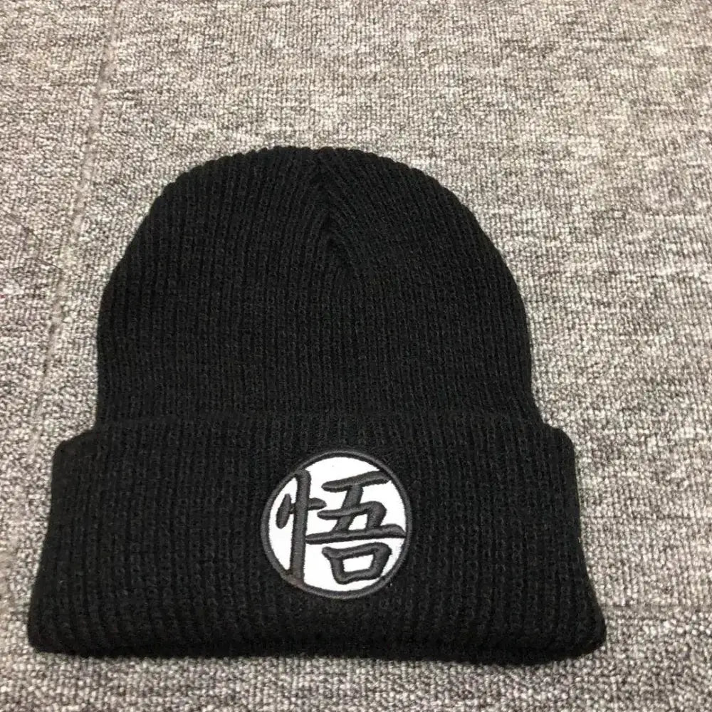 Black knitted winter beanie with white patch featuring black dragon ball embroidery of japanese character悟