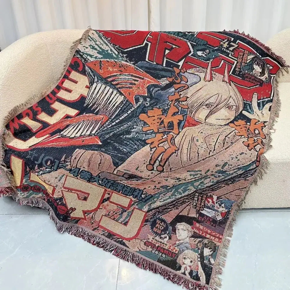 A vibrant red black and beige dragon ball one piece textile blanket made of cotton thread with anime characters and fringed edges