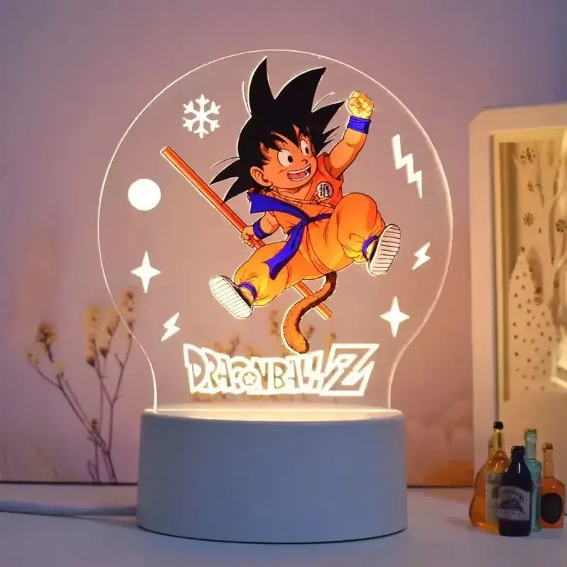 A glowing translucent acrylic dragon ball z goku 3d led lamp with orange and blue gi and snowflake lightning design