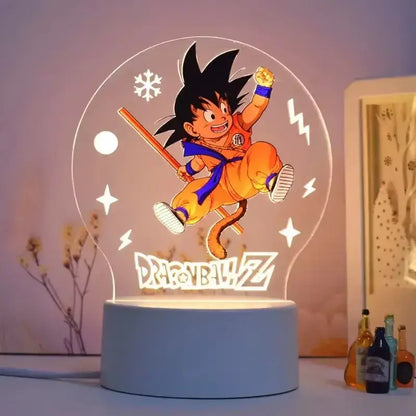 A glowing translucent acrylic dragon ball z goku 3d led lamp with orange and blue gi and snowflake lightning design