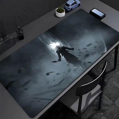 Black and gray dragon ball z goku gaming mouse pad with super saiyan goku illustration on a dark smoky desk mat