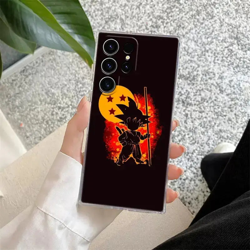 Back of clear samsung ultra phone case with black ball z goku silhouette and yellow starry moon on red background
