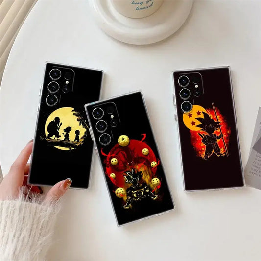 Three black samsung ultra phone cases with dragon ball z goku silhouettes against yellow and red suns with golden spheres