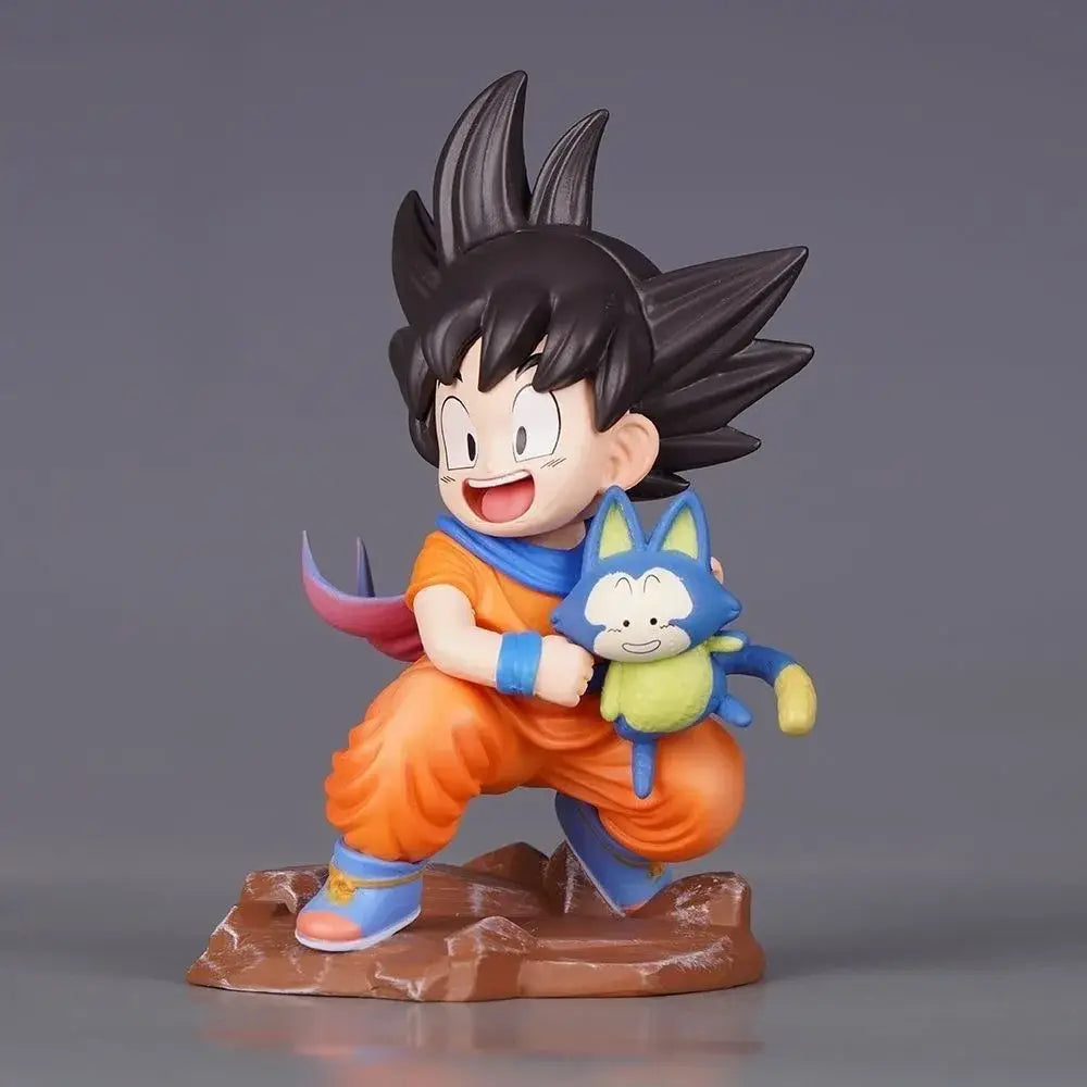 Dragon ball z goku pvc statue 10cm featuring durable pvc, orange gi, blue wristbands, and puar plushie on shoulder
