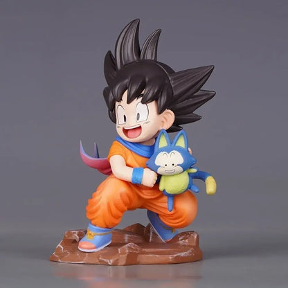 Dragon ball z goku pvc statue 10cm featuring durable pvc, orange gi, blue wristbands, and puar plushie on shoulder