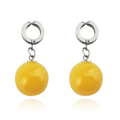 A pair of elegant yellow spherical dragon ball z potara cosplay accessory earrings with polished metallic hooks