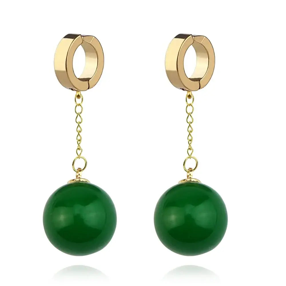 Gold-toned dragon ball z potara earrings with delicate chains suspending vibrant green jade beads for cosplay accessory