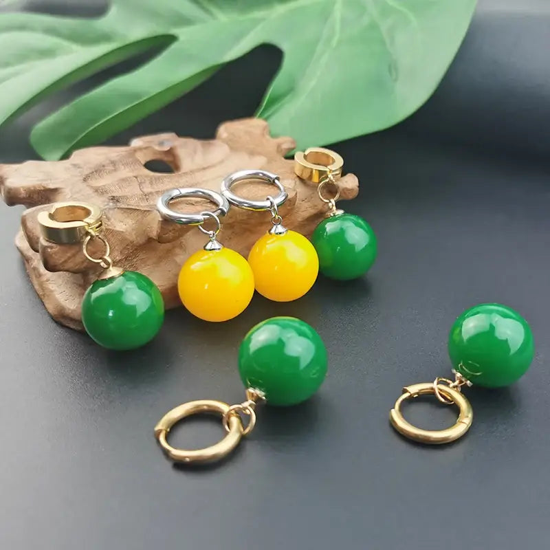Dragon ball z potara cosplay accessory featuring vibrant green and yellow spherical bead dangle earrings with gold clasps