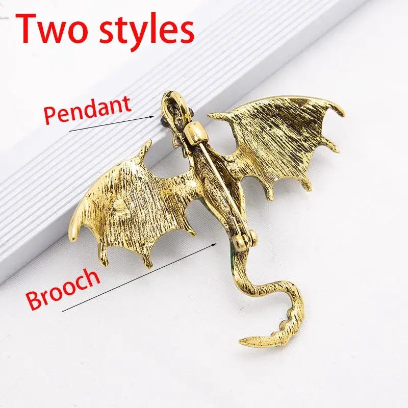 Gold-colored dragon colorful metal brooch lapel pin with textured wings and a curled tail enamel design