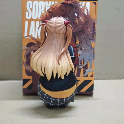 A detailed resin figurine of asuka langley soryu with blonde pigtails wearing a black grid skirt and yellow top in 15cm box