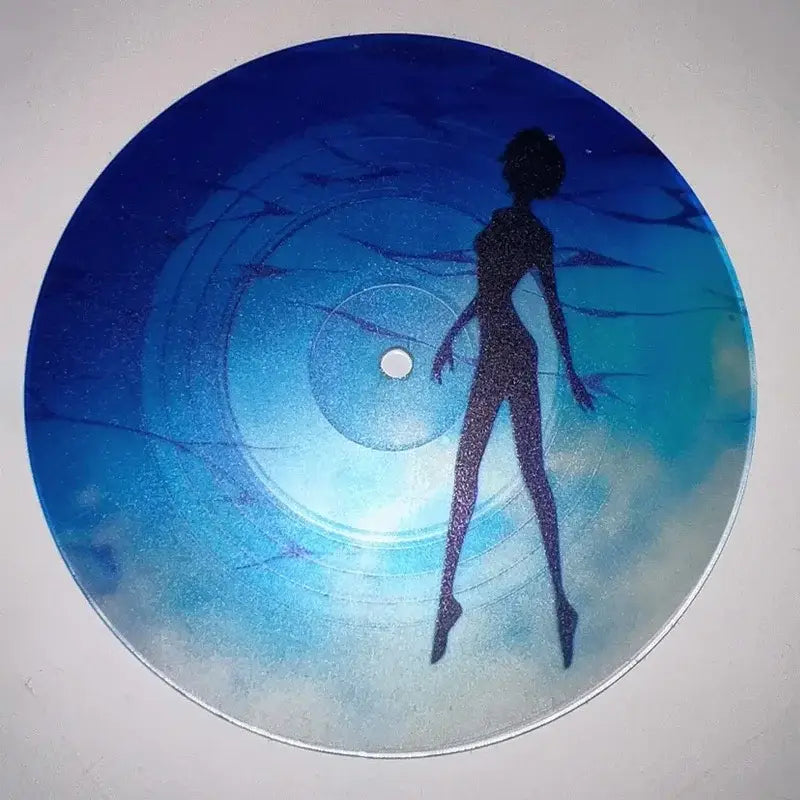 A circular blue vinyl evangelion ayanami rei acrylic coaster with a glittery woman silhouette on a gradient ocean background
