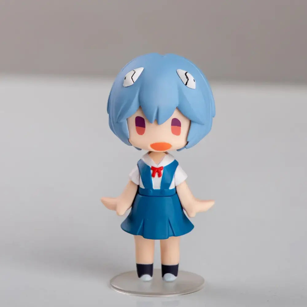A blue-haired chibi asuka langley figurine in white shirt with red bow and navy skirt for evangelion ayanami rei car decor