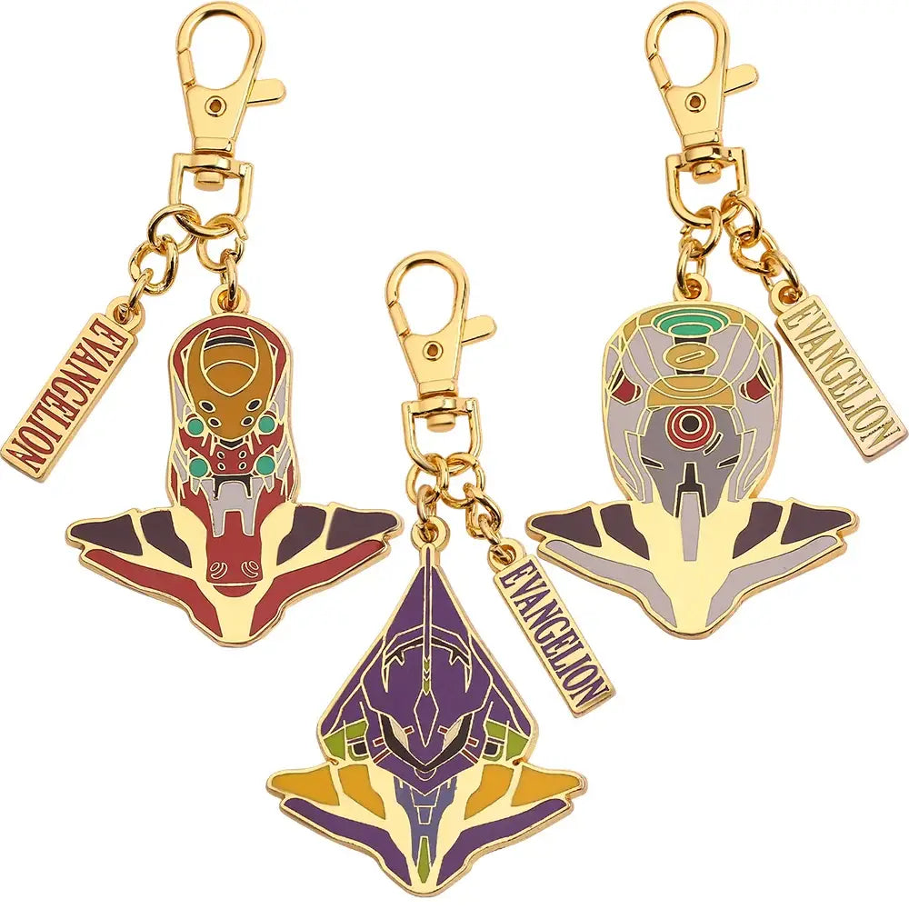 Three gold-toned enamel evangelion ayanami rei metal pendant keychains with colorful faces and wing-like bases