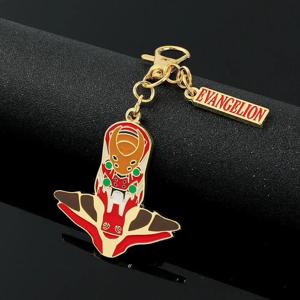 A gold-toned enamel metal spear keychain featuring ayanami rei metal design with red white and green evangelion colors
